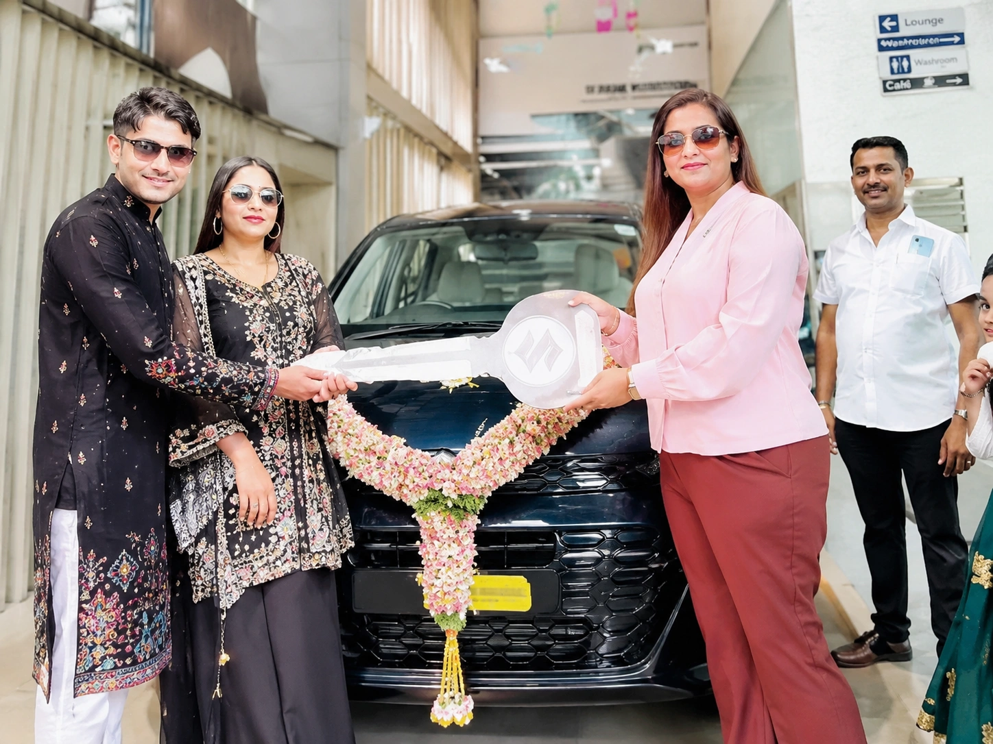 Happy customer receiving car delivery